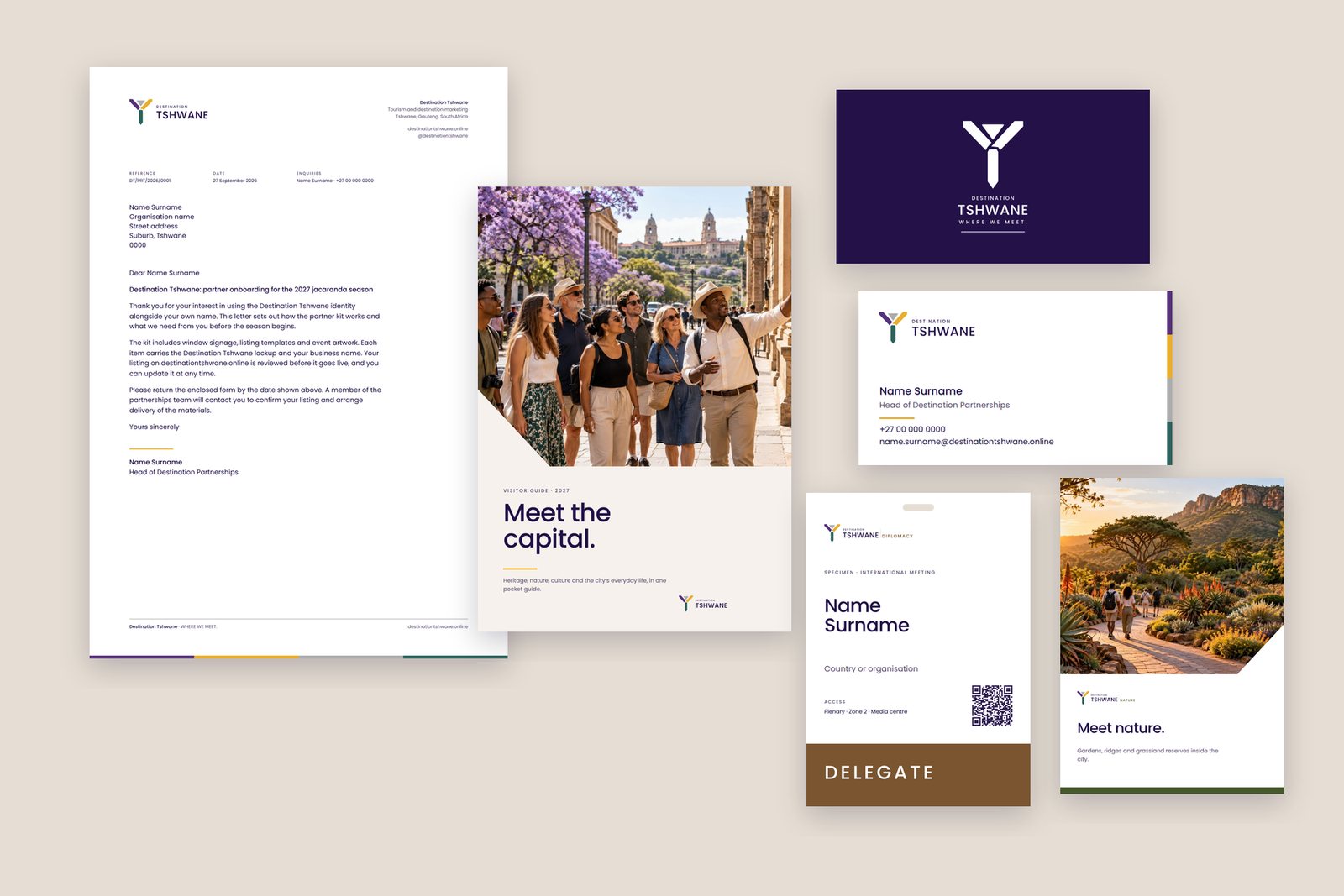 Stationery and visitor materials: letterhead, visitor guide, business cards, delegate badge and an experience card.
